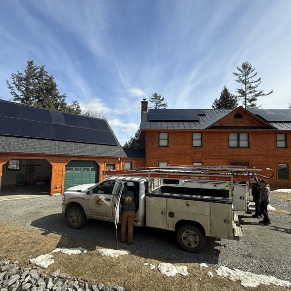 Newly installed solar panels on house and garage in Vermont